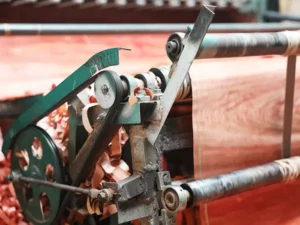 wood factory operations: office desk, exterior building, sanding machinery, veneer rolling, and the automated production line.