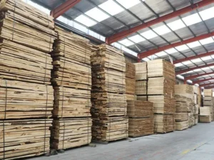 wood factory operations: office desk, exterior building, sanding machinery, veneer rolling, and the automated production line.