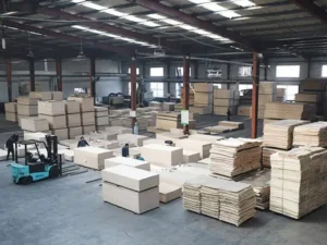 wood factory operations: office desk, exterior building, sanding machinery, veneer rolling, and the automated production line.