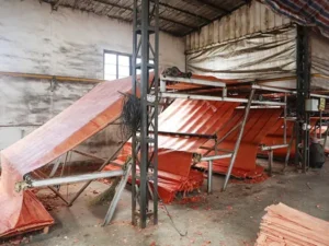 wood factory operations: office desk, exterior building, sanding machinery, veneer rolling, and the automated production line.
