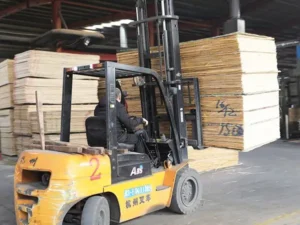 wood factory operations: office desk, exterior building, sanding machinery, veneer rolling, and the automated production line.