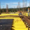 H20 timber beams and film faced plywood used together in a concrete formwork system for construction projects.