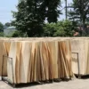 Veneers being dried before plywood production to control moisture content and improve adhesive bonding during hot pressing.
