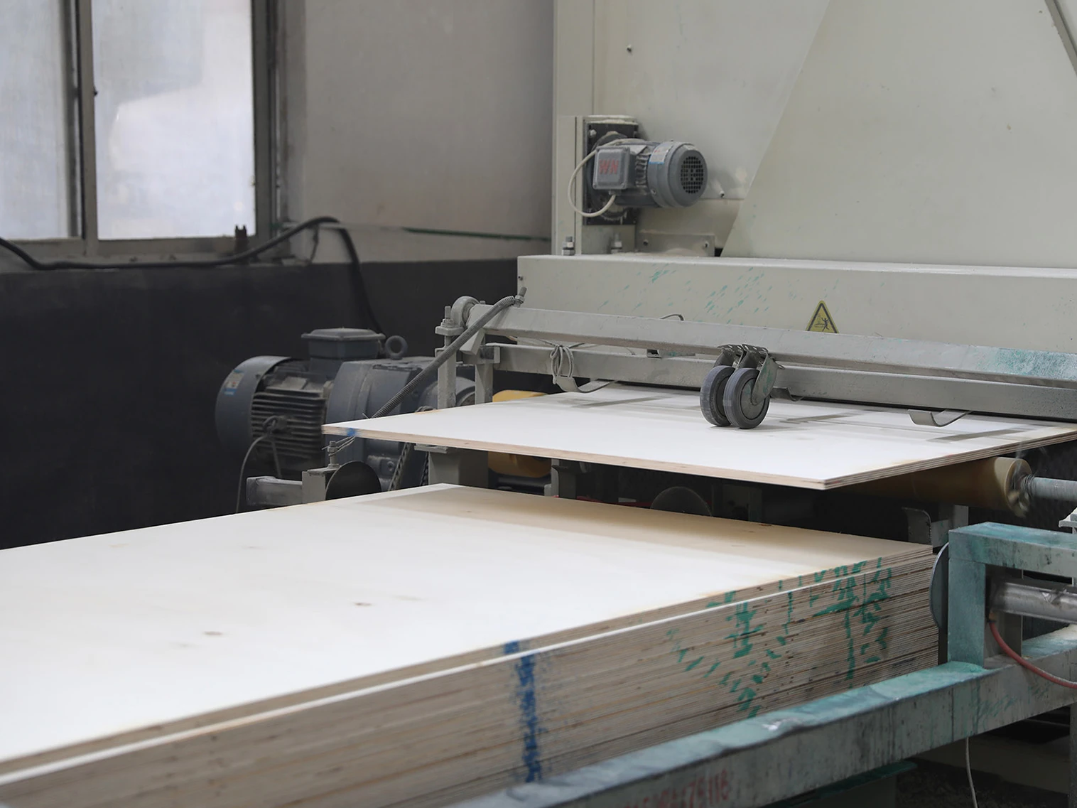 Plywood production line in China factory with automated veneer pressing and panel manufacturing equipment