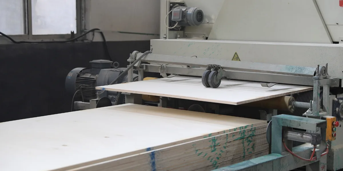 Melamine plywood production line in China factory showing laminated board manufacturing process
