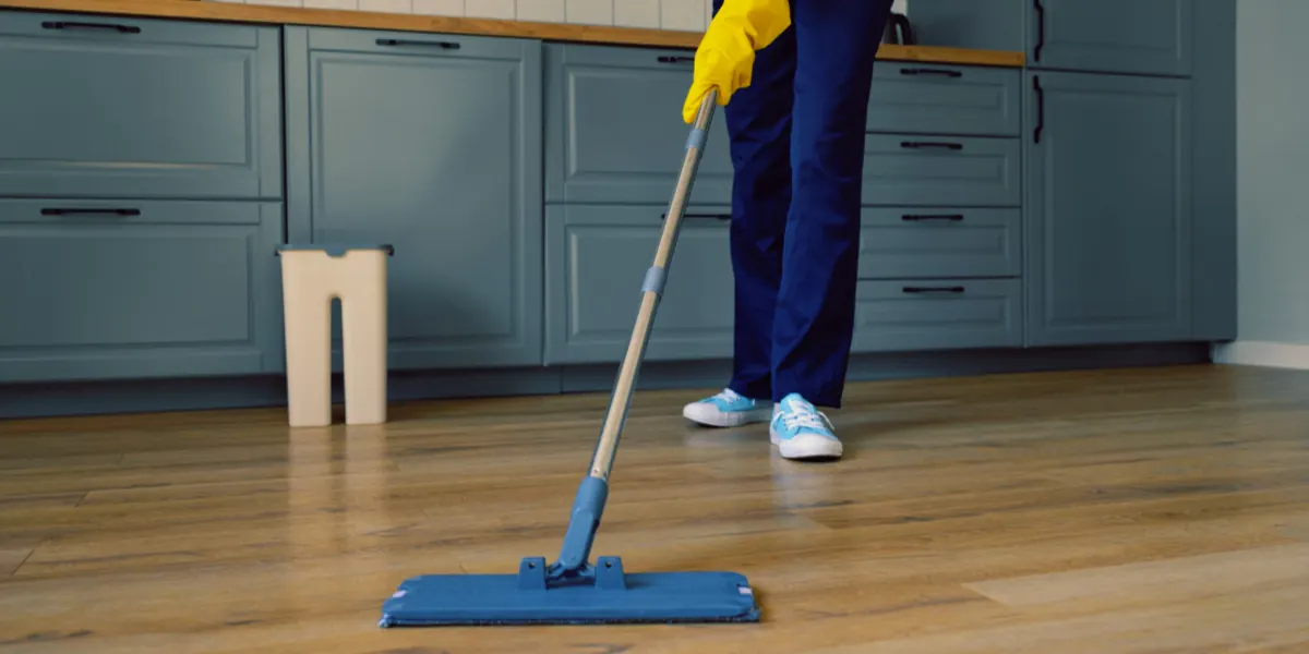 Daily SPC floor maintenance with microfiber mop and dust removal