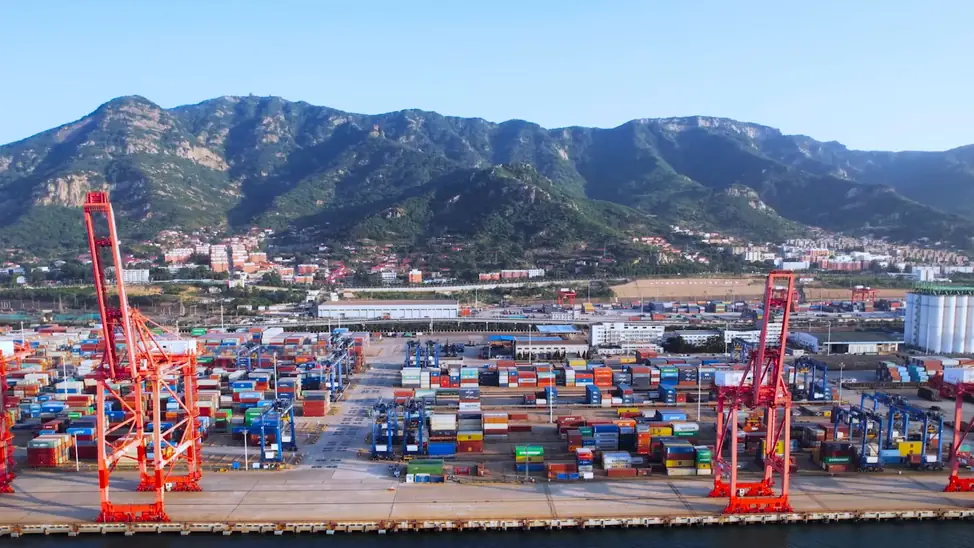 Container cargo ship at sea transporting goods for international shipping company