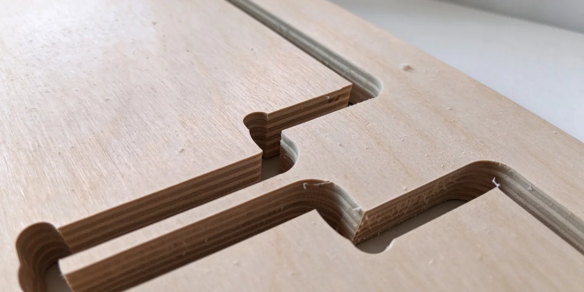 CNC machined edge showing birch plywood layer construction