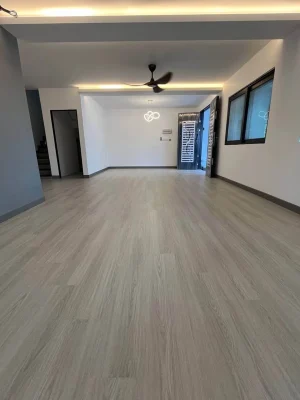 Professional team installing SPC flooring across a large commercial space